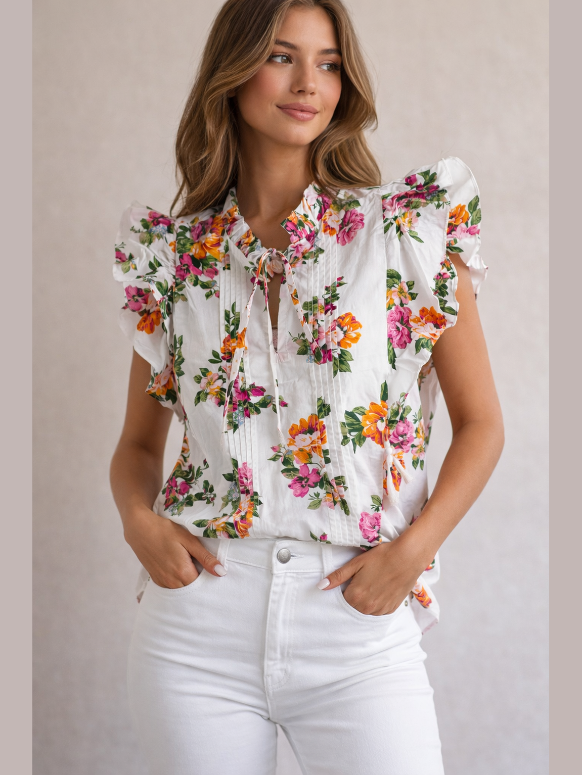 White floral print flutter top with ruffle collar and tie-front detail