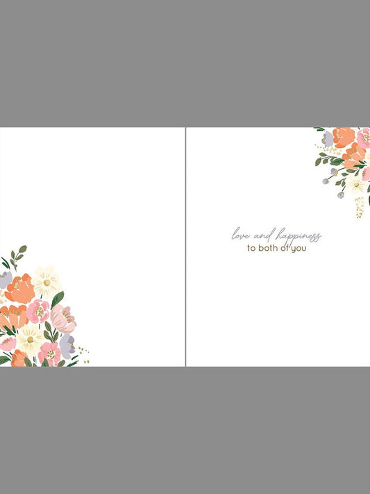 Inside of wedding card showing floral accents and 'love and happiness' message