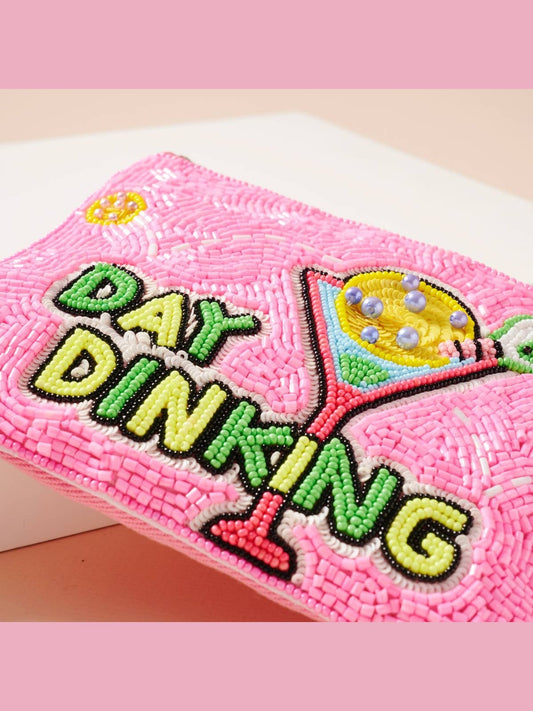 Close-up of pink seed beadwork and "Day Dinking" text