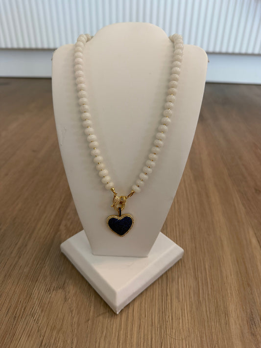 White glass beaded necklace with blue glitter heart pendant