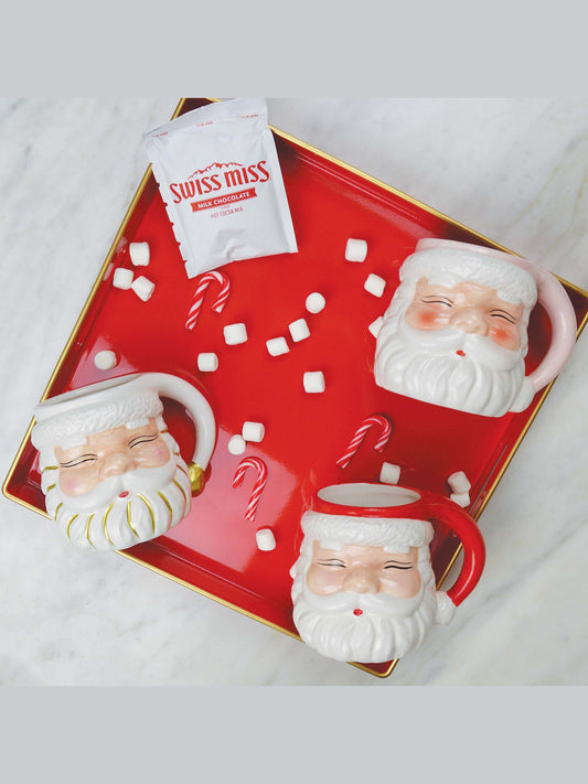 Set of three Santa head mugs in pink, red, and gold stripes
